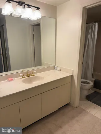 a bathroom with a toilet and a bathtub