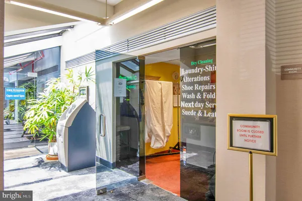 a view of a swimming pool with a bench and a chairs