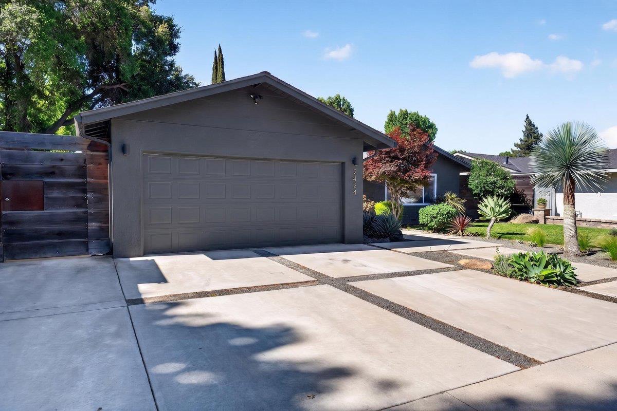 2424 Killarney Way Modesto, CA 95355 - Photo 30 of 30 a view of entrance gate of house and car parked