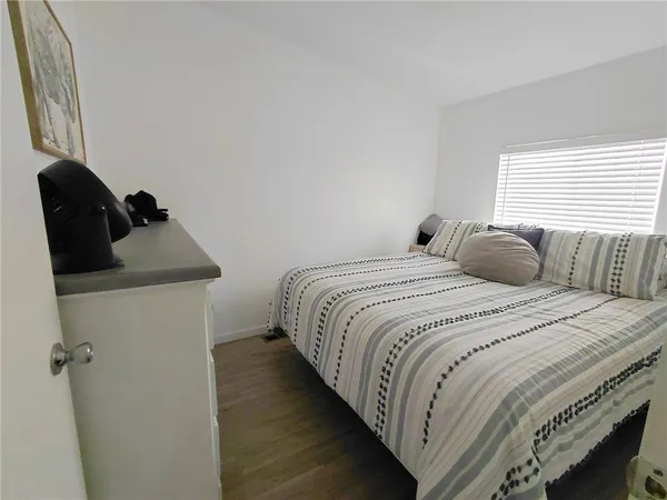 a bedroom with a bed and a closet