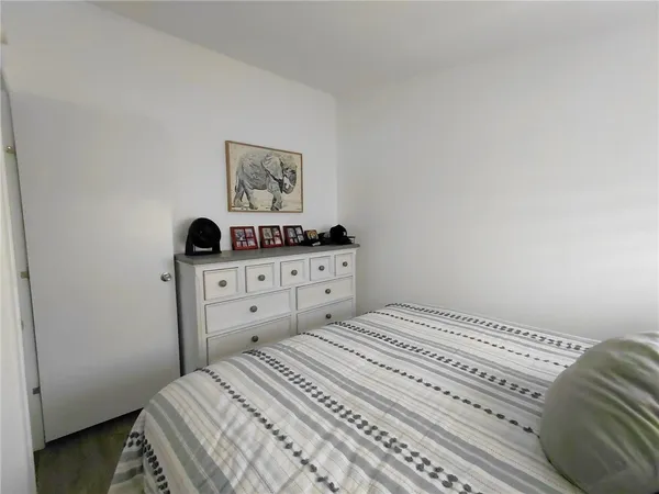 a bedroom with a bed and a cabinets