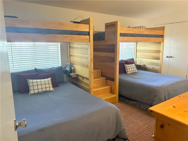 a bedroom with furniture and window