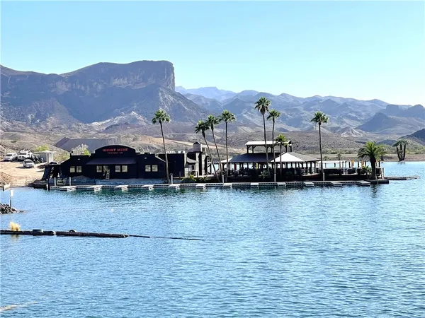 a view of houses with water view and a mountain view
