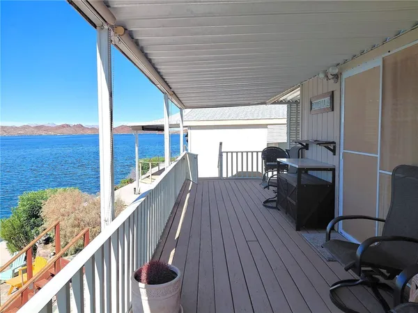 a view of a balcony with chairs