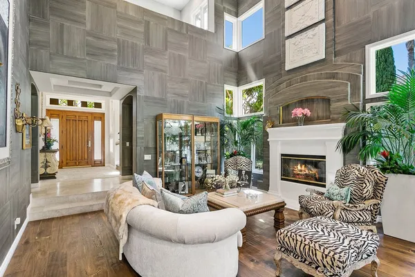 a living room with furniture and a fireplace