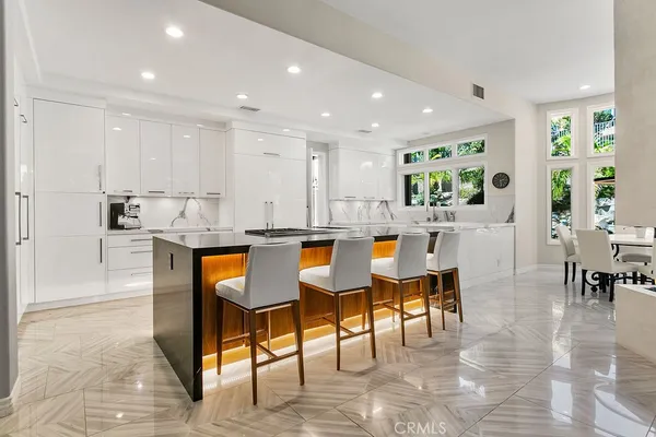 a living room with furniture potted plant and a window