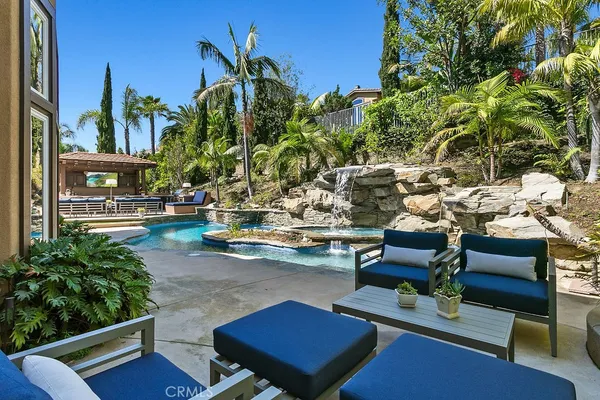 a view of walk in closet with clothes