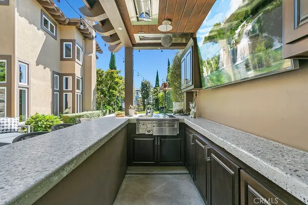 a front view of a house with a yard table and chairs