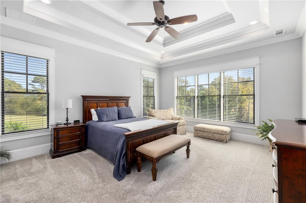 938 Austin Road Winder, GA 30680 - Photo 17 of 50 a bedroom with a bed couch and window