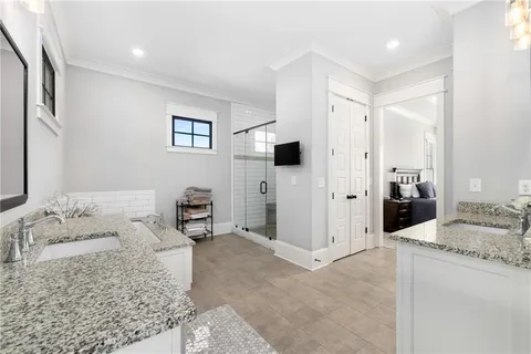a bathroom with a sink vanity mirror and toilet