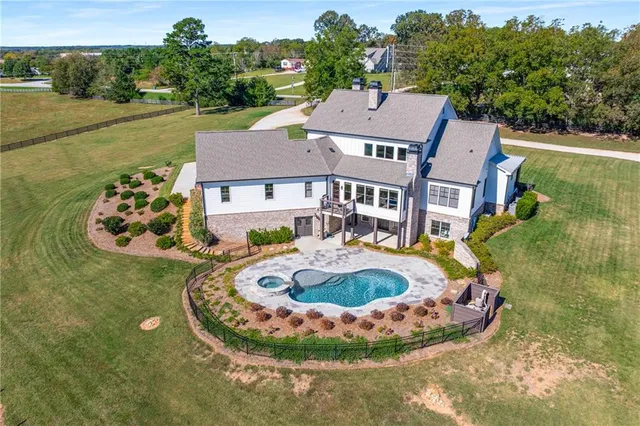an aerial view of a house with outdoor space