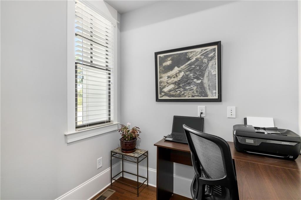 938 Austin Road Winder, GA 30680 - Photo 22 of 50 a view of a workspace with furniture and a window