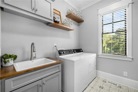 a bathroom with a granite countertop sink mirror and toilet