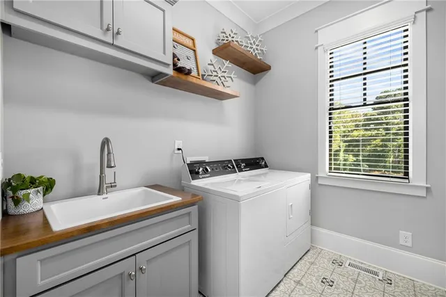 a bathroom with a granite countertop sink mirror and toilet
