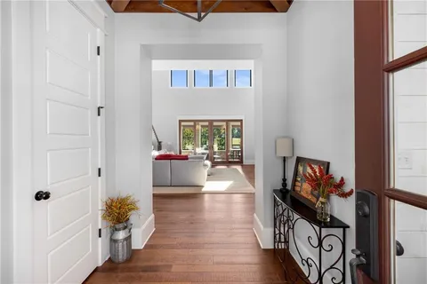 a living room with furniture or stairs and a wooden floor