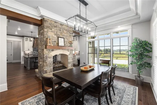 a kitchen with stainless steel appliances granite countertop a stove refrigerator and a sink