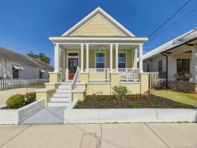 a front view of a house with a porch
