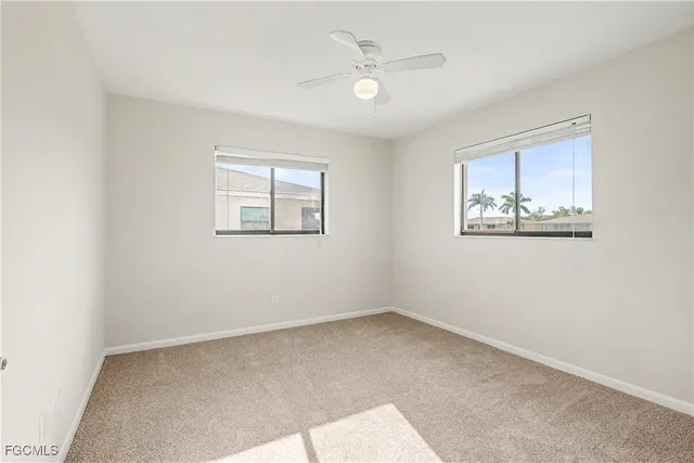 a view of livingroom with an empty space and a ceiling fan