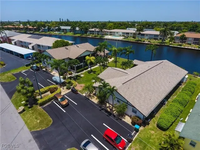 an aerial view of a house with a lake view