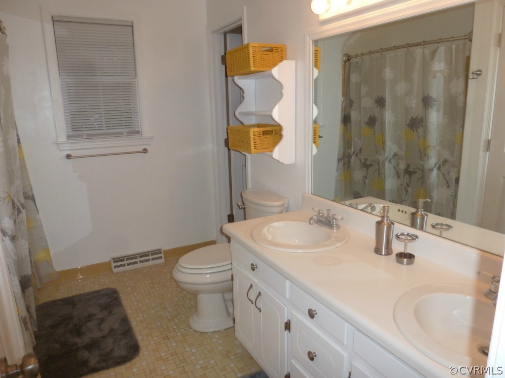 3600 Hemlock Road Chester, VA 23831 - Photo 13 of 24 a bathroom with a sink and a mirror