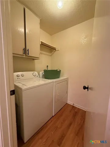 a bedroom with a bed and a table