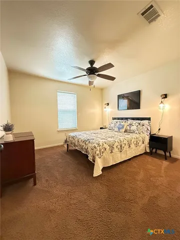 a view of a hallway view with wooden floor and staircase