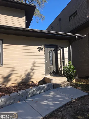 a view of house with yard