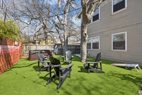 a view of a backyard with table and chairs
