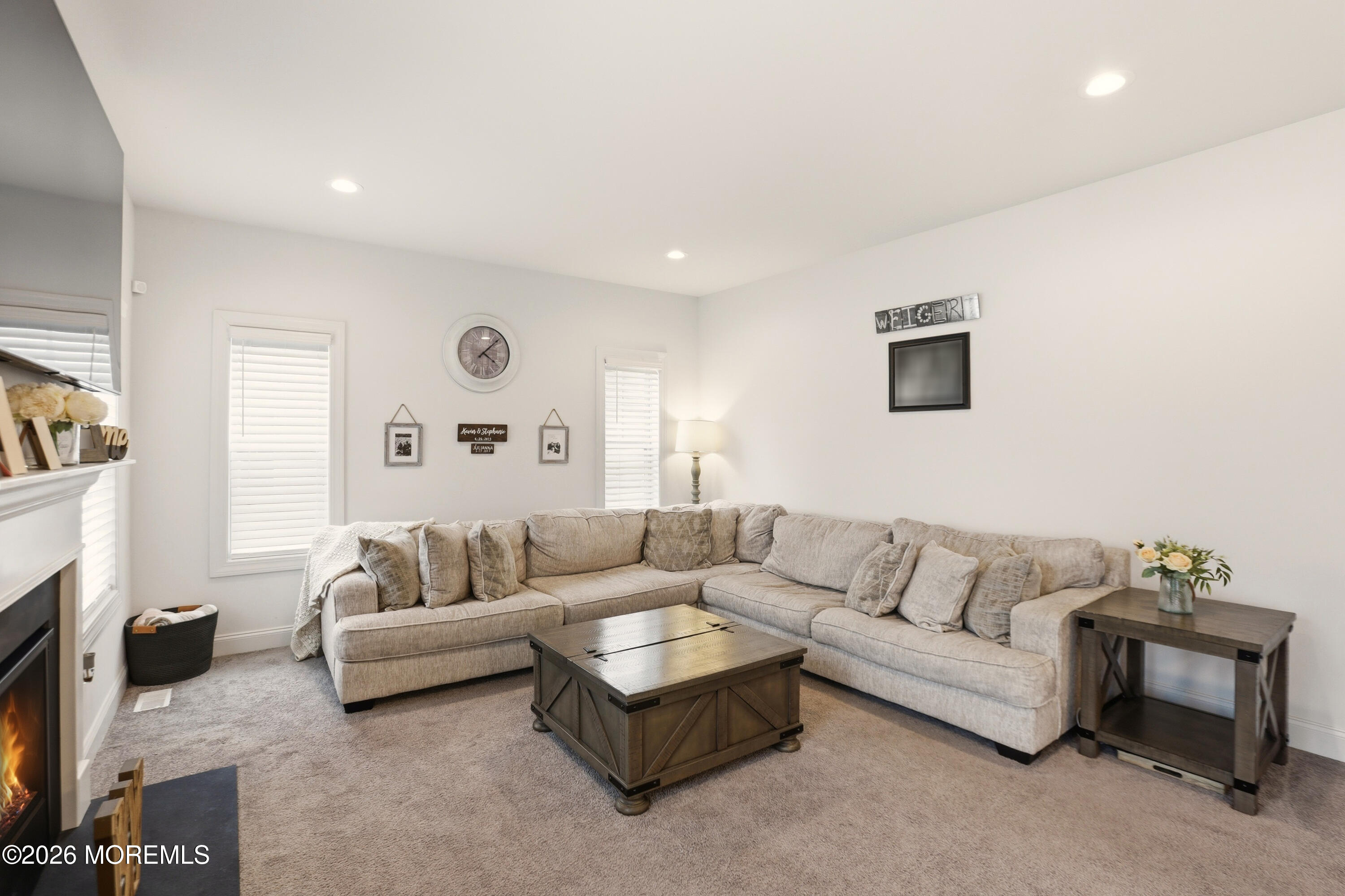 4 Tasha Lane Howell, NJ 07731 - Photo 14 of 55 a living room with furniture and a fireplace
