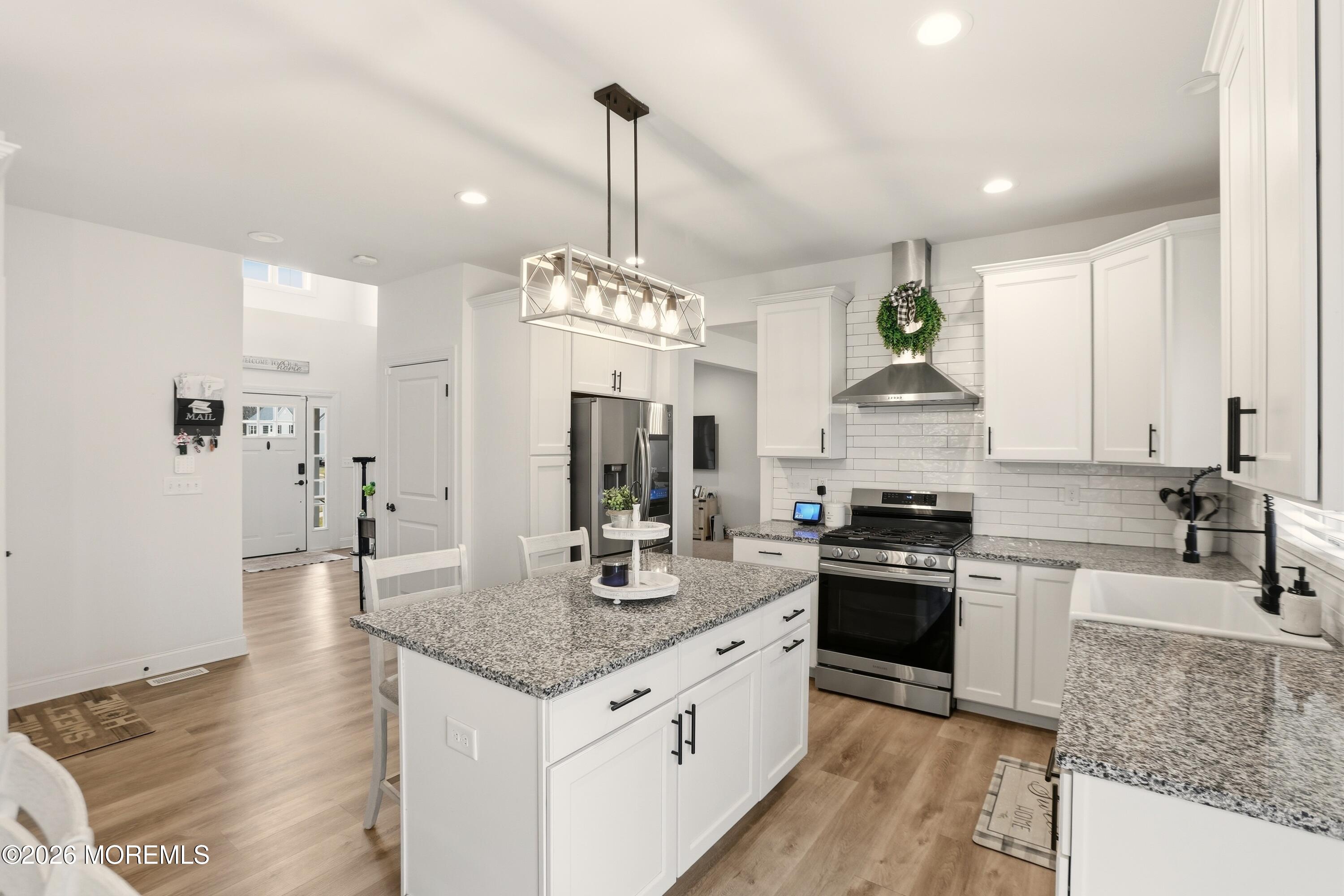 4 Tasha Lane Howell, NJ 07731 - Photo 21 of 55 a kitchen with stainless steel appliances granite countertop a sink stove and refrigerator