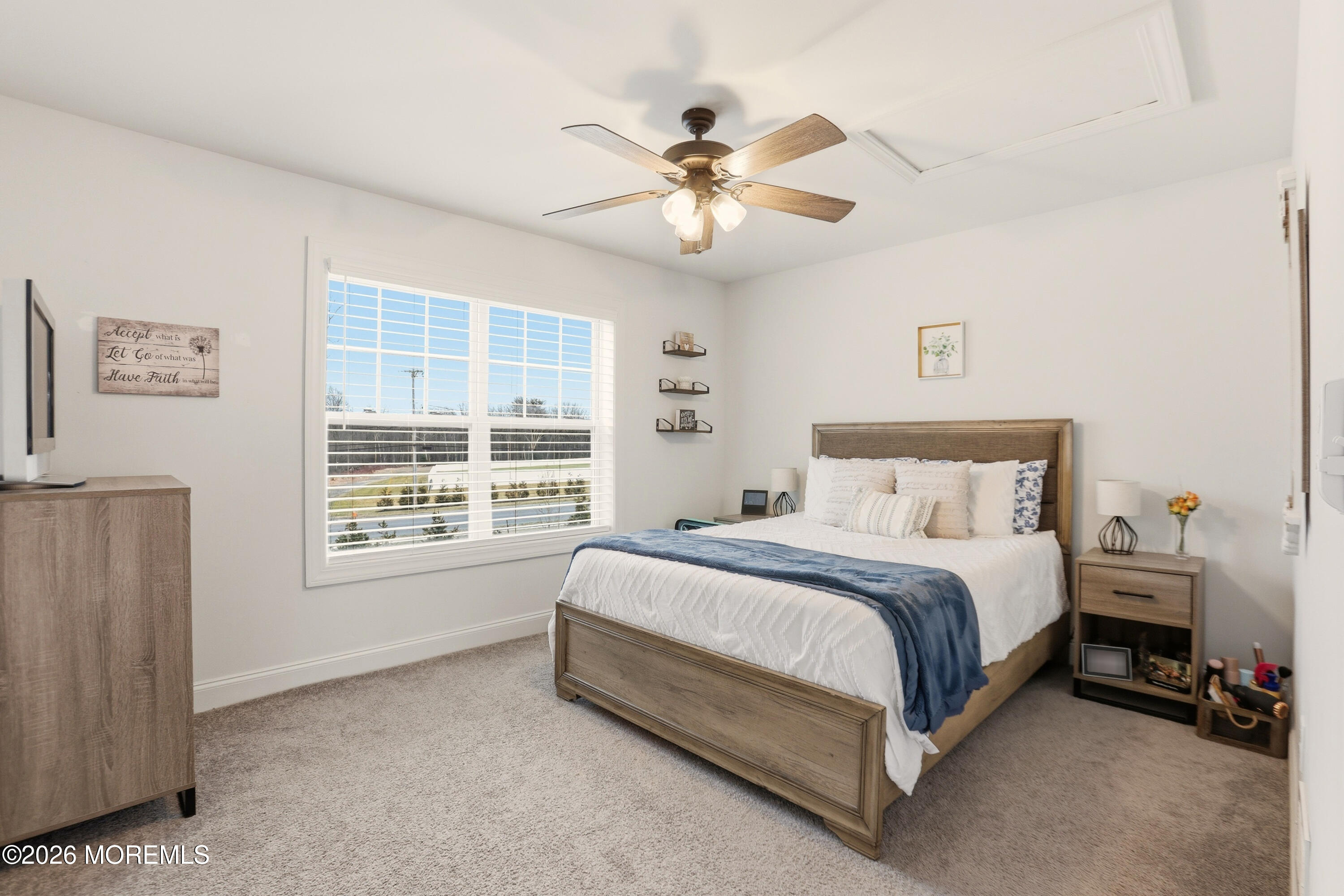 4 Tasha Lane Howell, NJ 07731 - Photo 23 of 55 a spacious bedroom with a bed and a chandelier