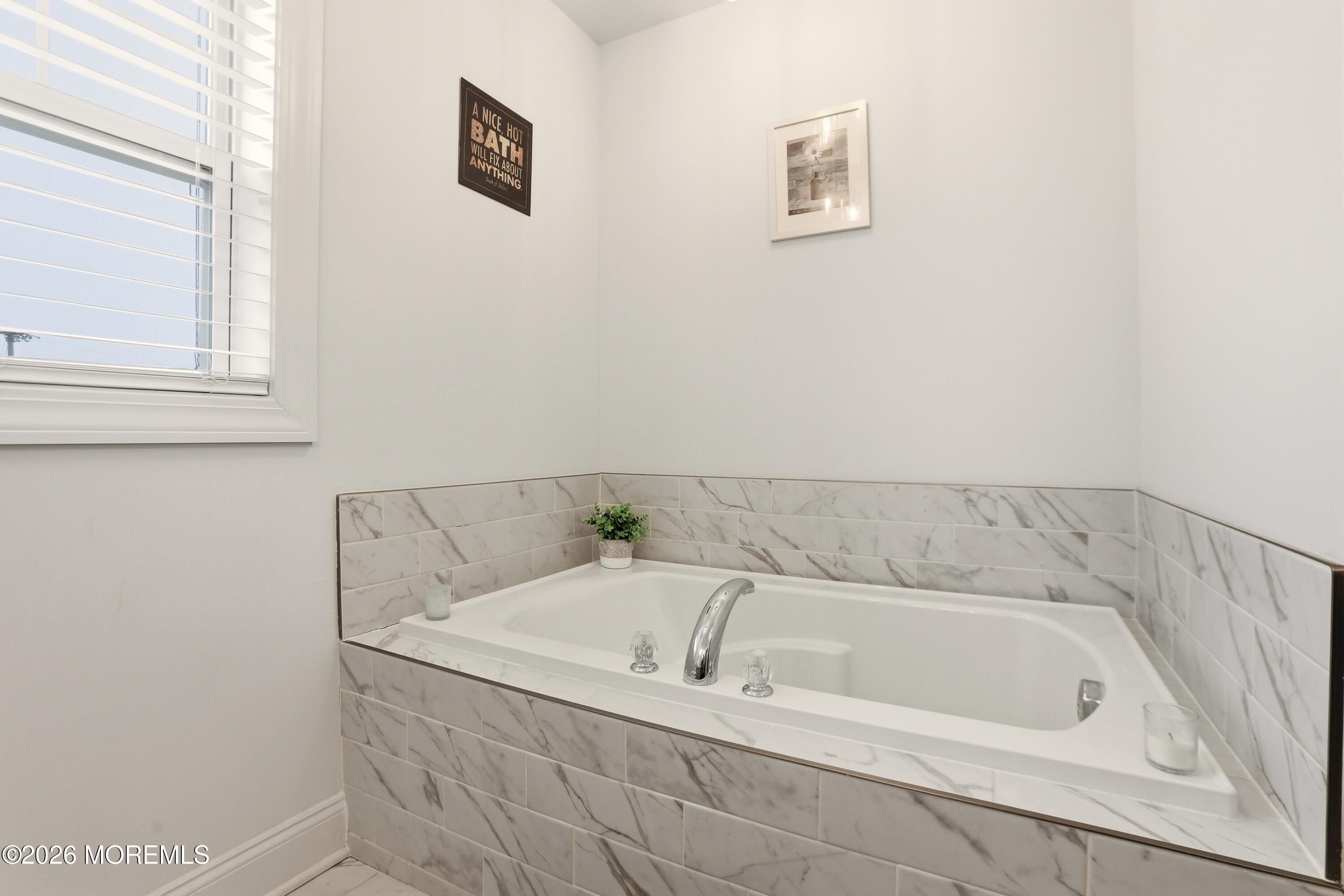 4 Tasha Lane Howell, NJ 07731 - Photo 33 of 55 a bath tub sitting next to a window