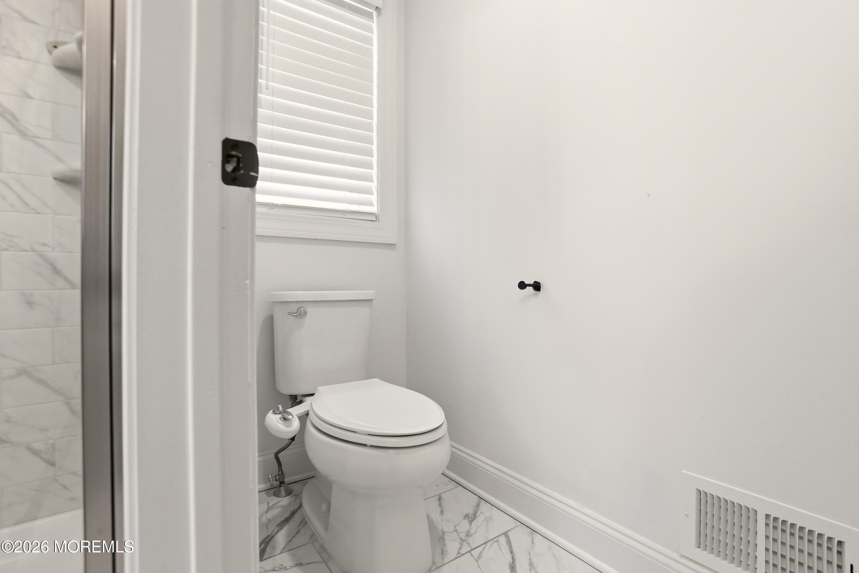 4 Tasha Lane Howell, NJ 07731 - Photo 34 of 55 a white toilet sitting next to a shower