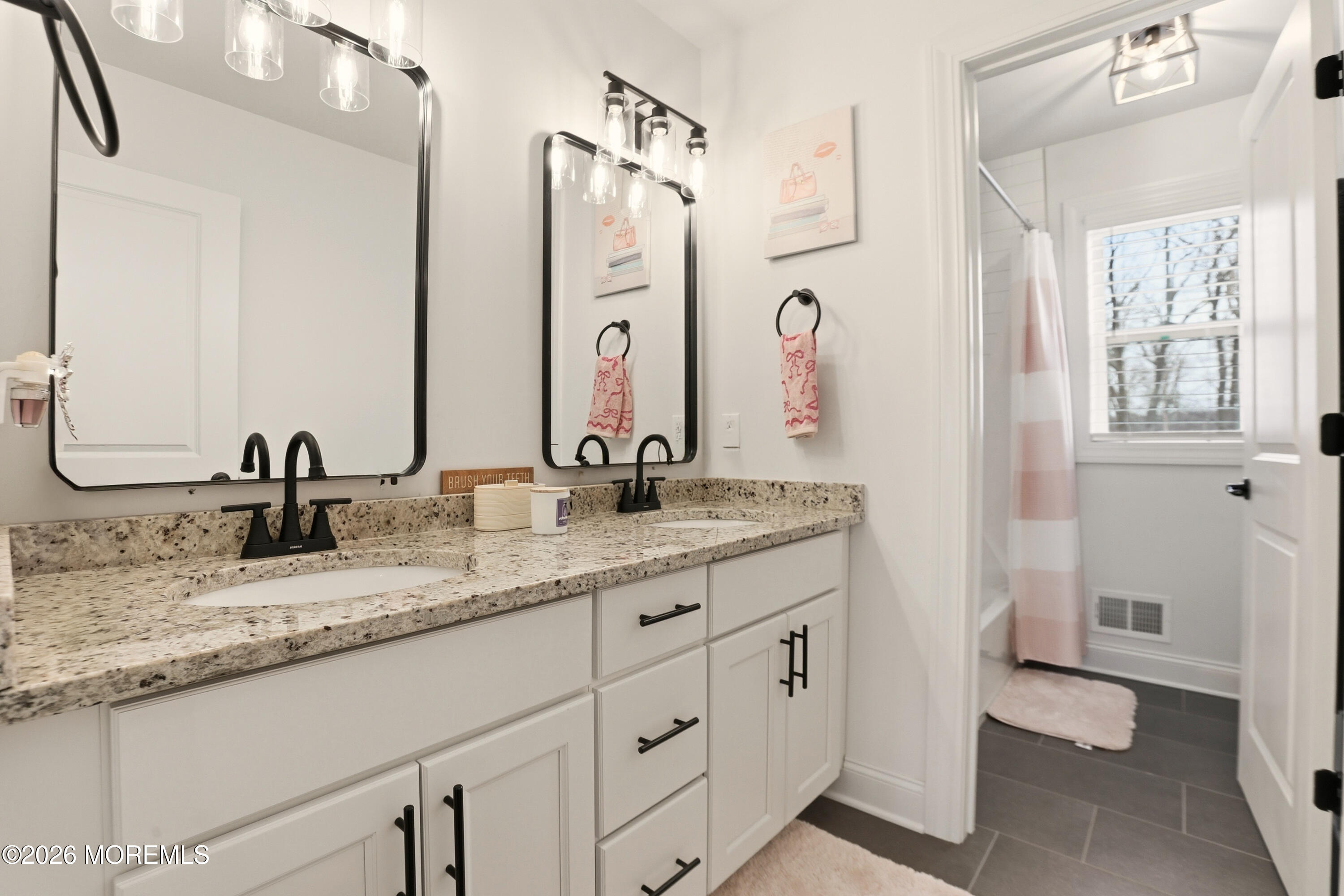 4 Tasha Lane Howell, NJ 07731 - Photo 37 of 55 a bathroom with double sink and a mirror