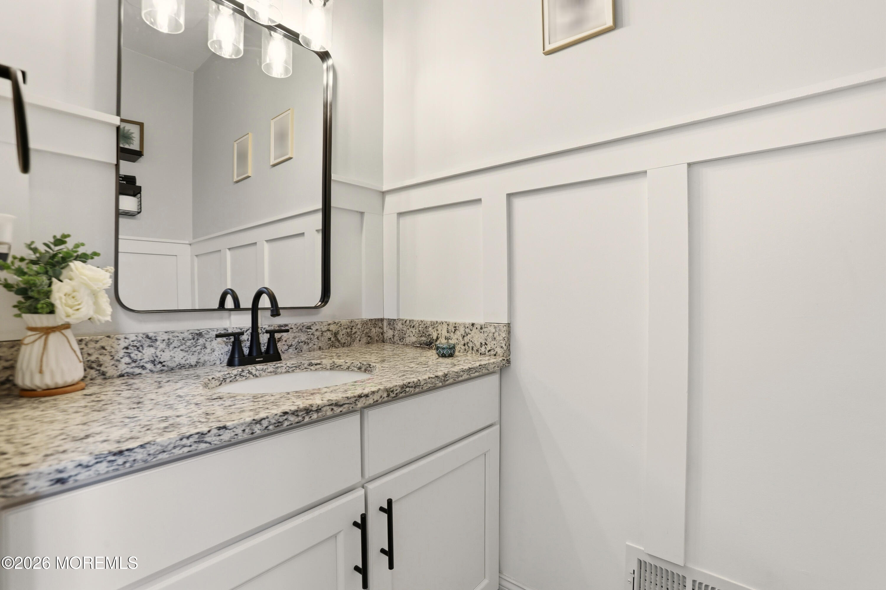 4 Tasha Lane Howell, NJ 07731 - Photo 39 of 55 a bathroom with a granite countertop sink and a mirror