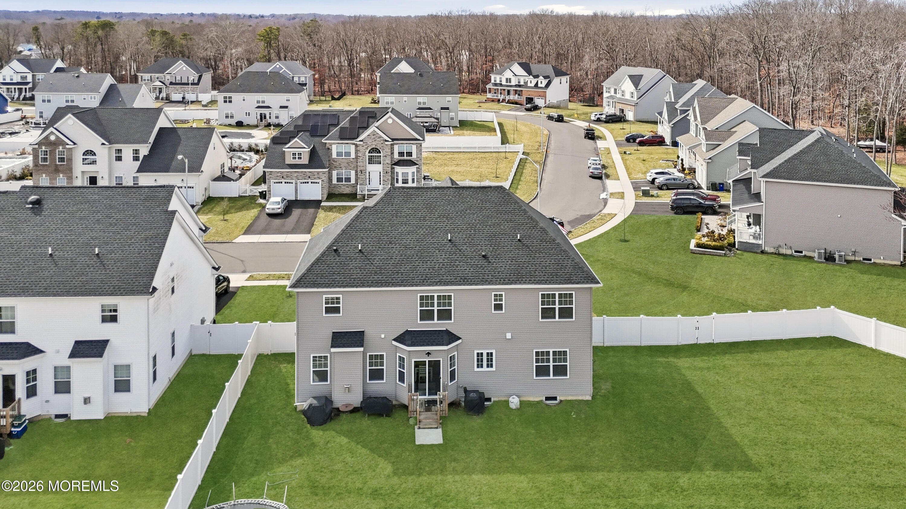 4 Tasha Lane Howell, NJ 07731 - Photo 46 of 55 a aerial view of a house with swimming pool and big yard