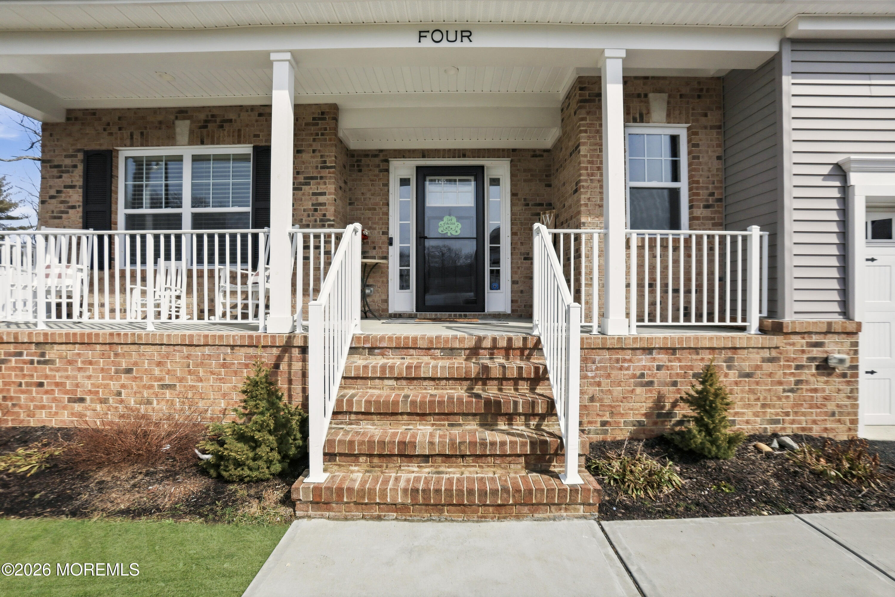 4 Tasha Lane Howell, NJ 07731 - Photo 5 of 55 front view of a house with a garden