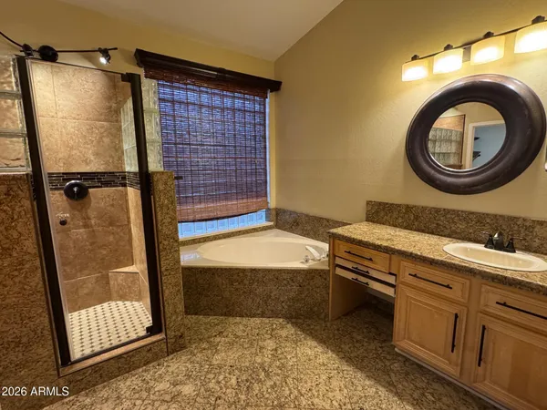 a bathroom with a sink a toilet and a shower