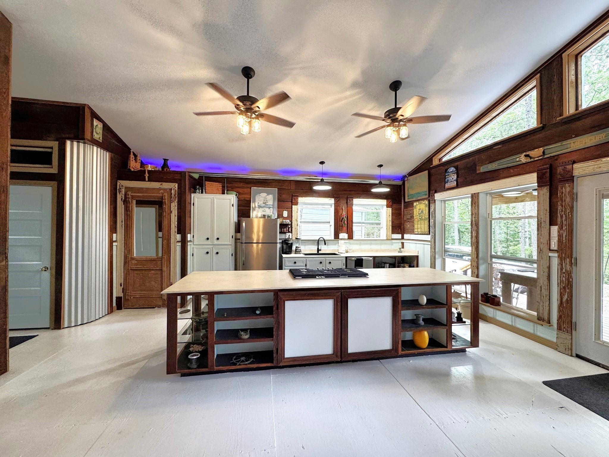 331 County Road 3240 Colmesneil, TX 75938 - Photo 12 of 50 a large kitchen with a large counter space a sink appliances and living room