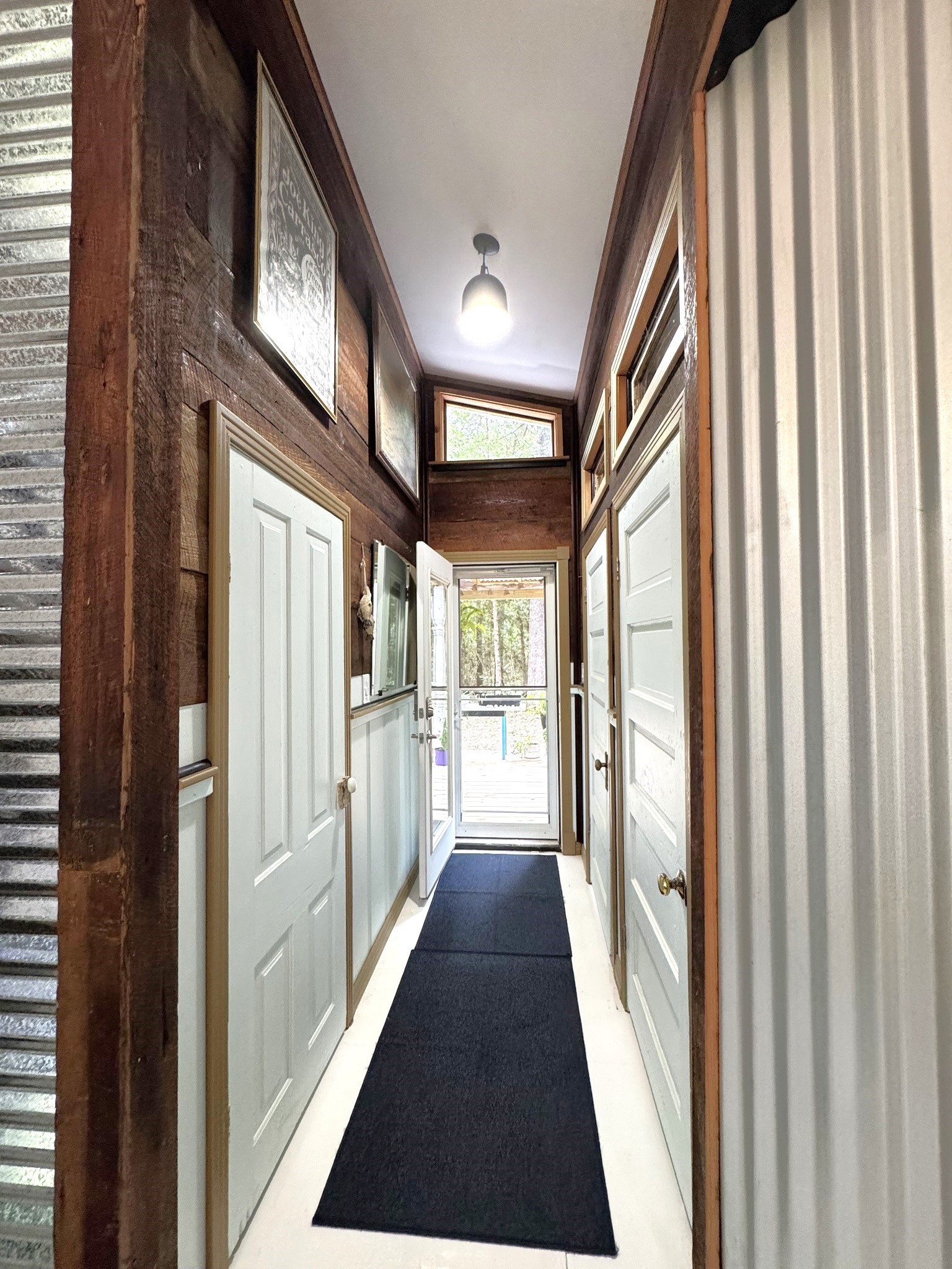 331 County Road 3240 Colmesneil, TX 75938 - Photo 22 of 50 a view of hallway with wooden floor and stairs