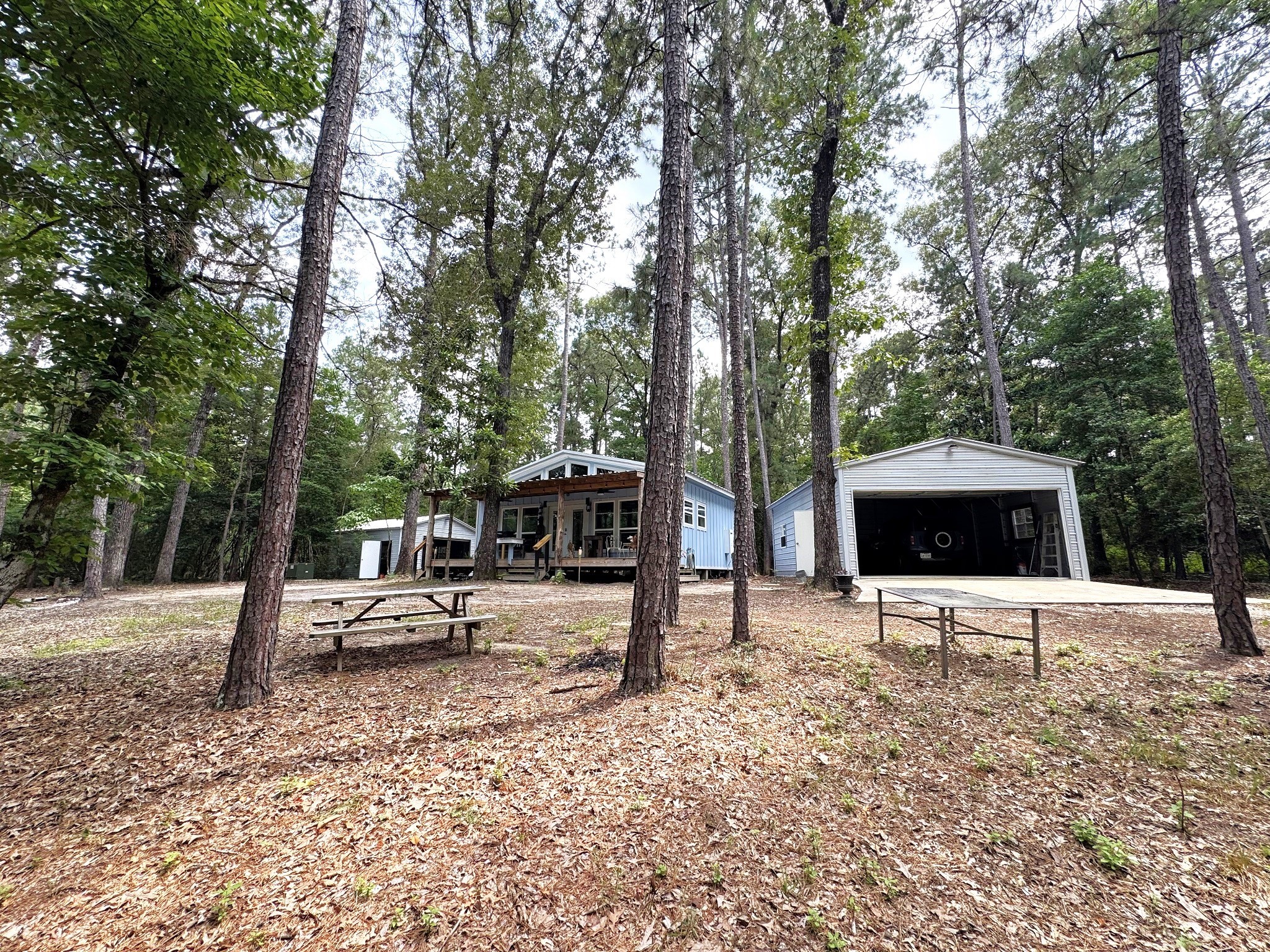 331 County Road 3240 Colmesneil, TX 75938 - Photo 48 of 50 a view of a outdoor space with a patio and yard