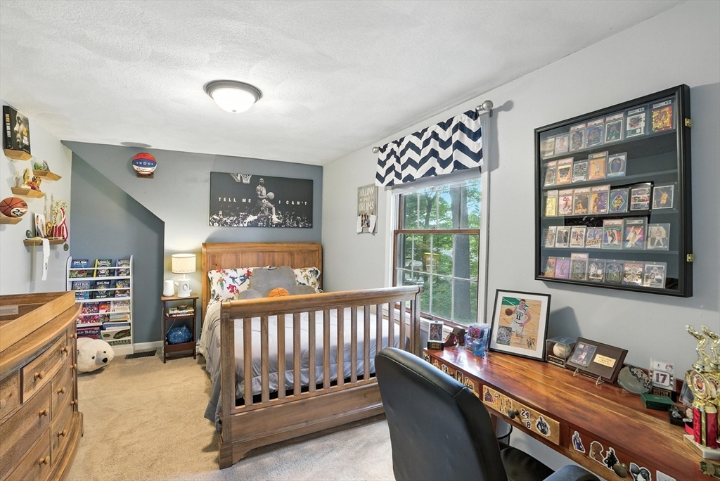 22 Dean Street Hudson, MA 01749 - Photo 18 of 30 a bedroom with furniture and a window