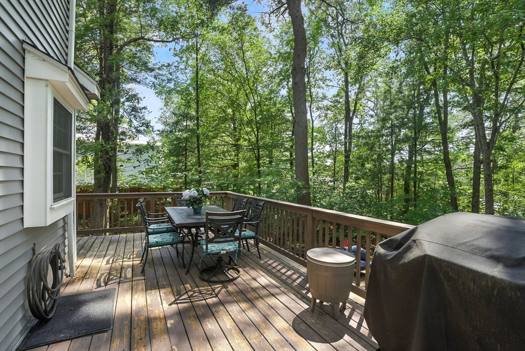 22 Dean Street Hudson, MA 01749 - Photo 23 of 30 a view of a balcony with chairs and wooden floor