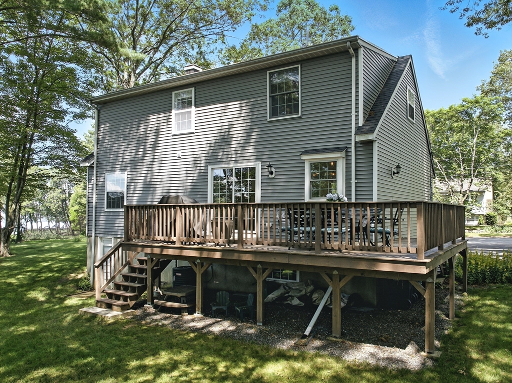 22 Dean Street Hudson, MA 01749 - Photo 24 of 30 a balcony with table and chairs