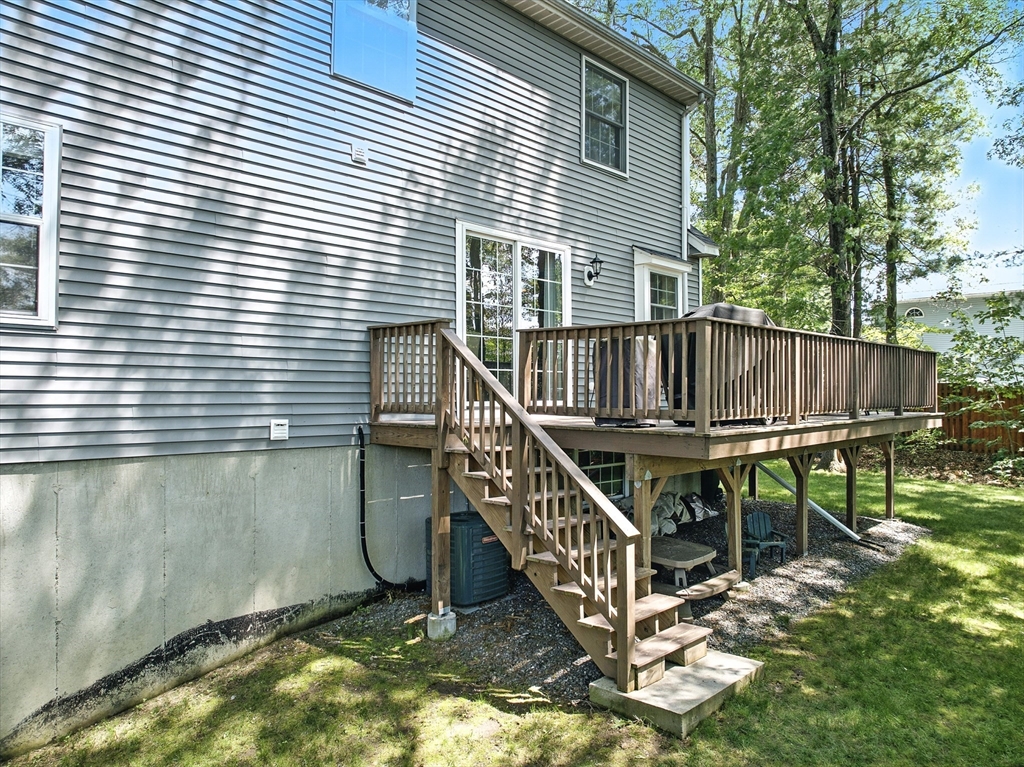22 Dean Street Hudson, MA 01749 - Photo 26 of 30 a balcony with table and chairs