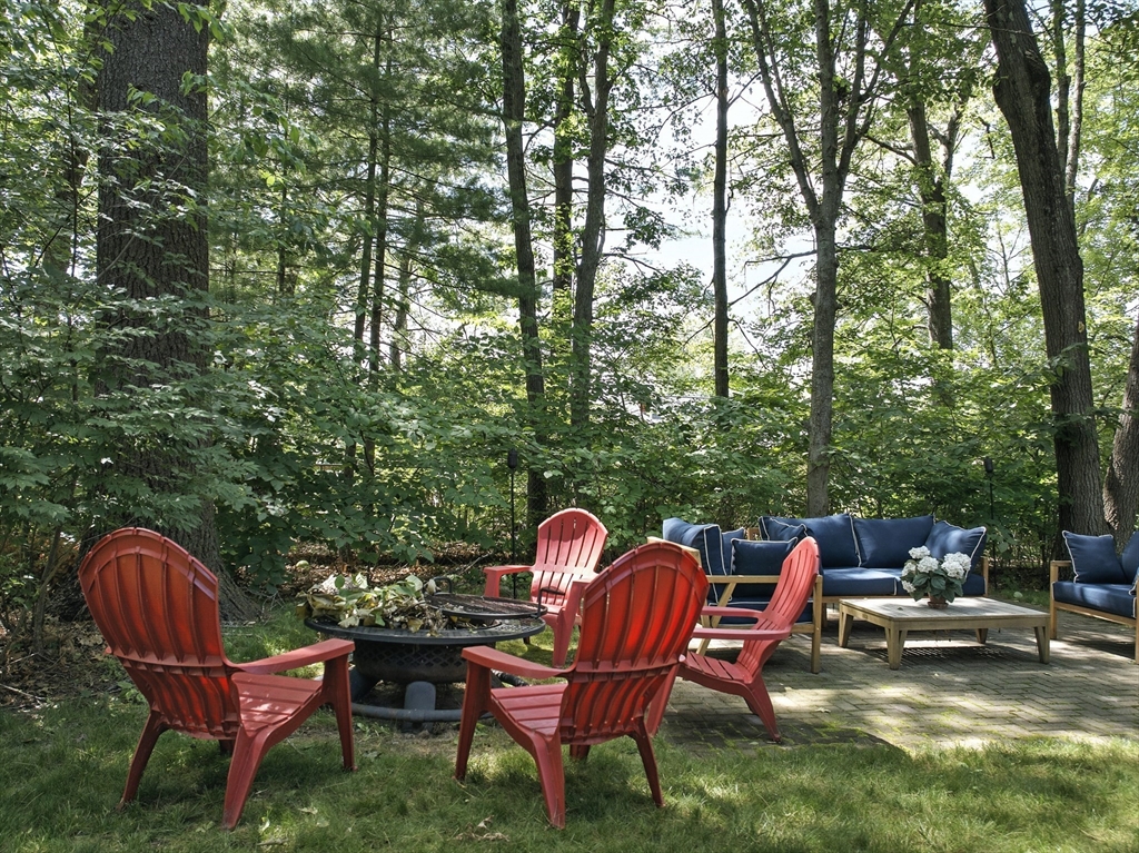 22 Dean Street Hudson, MA 01749 - Photo 28 of 30 a backyard of a house with table and chairs