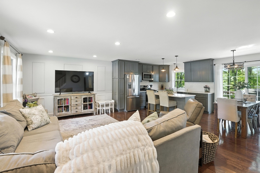 22 Dean Street Hudson, MA 01749 - Photo 4 of 30 a living room with furniture and a flat screen tv