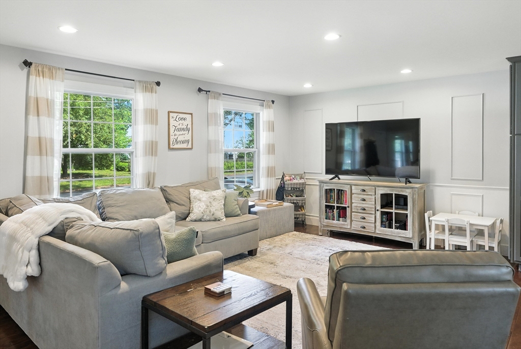 22 Dean Street Hudson, MA 01749 - Photo 5 of 30 a living room with furniture and a flat screen tv