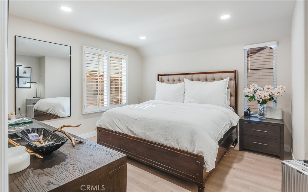 23301 Montecito Place Valencia, CA 91354 - Photo 17 of 41 a bedroom with a bed and wooden floor