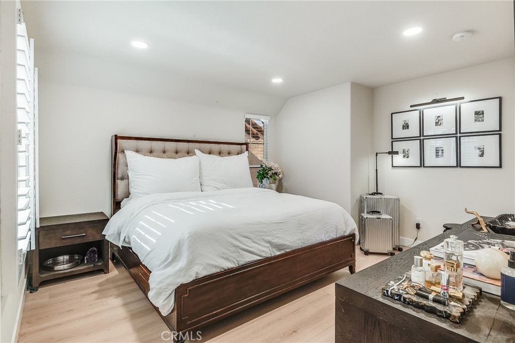 23301 Montecito Place Valencia, CA 91354 - Photo 19 of 41 a bedroom with a bed and wooden floor